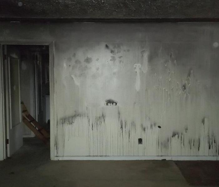 Soot and smoke damage to a wall.